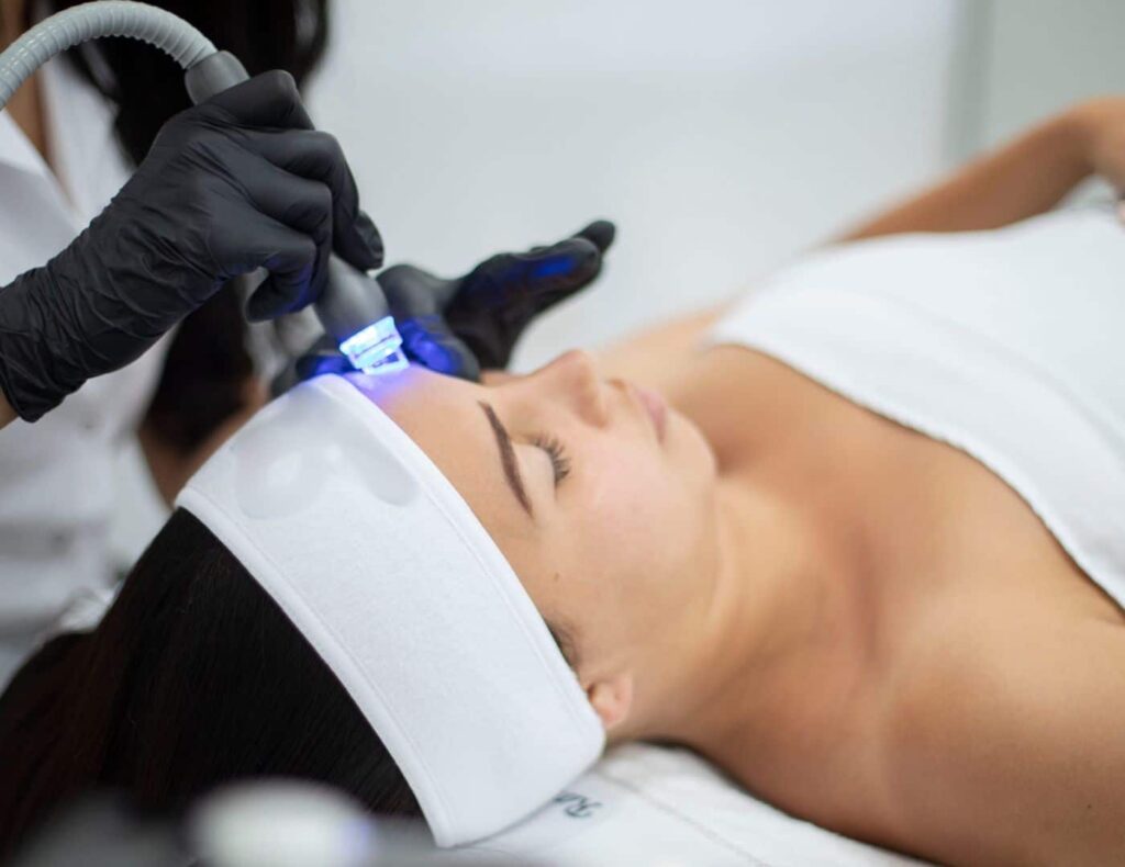 Eve - Ace of Face, hydradermabrasion facial treatment on new Eve device on woman in clinic